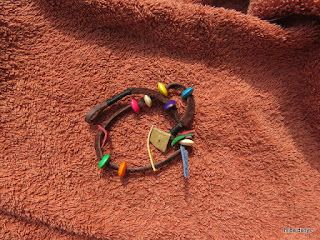 LoveLea's leather choker/bracelet with wooden beads.