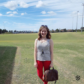 awayfromtheblue Instagram | picnic outfit  red skinny jeans with louis vuitton speedy bandouliere and striped tank