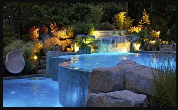 Pool Fountain Design Ideas with Stone Fountain and Comfortable Chairs