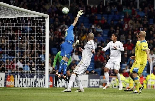 APOEL goalkeeper Urko Pardo fails to stop a goal from Real Madrid player Cristiano Ronaldo