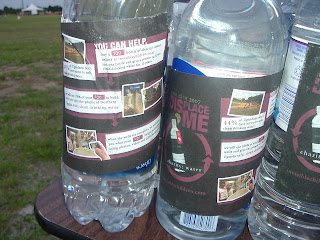 A close up shot of three of the thousands of water bottles