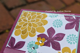 Close-up image of glitter added to stamped flowers.