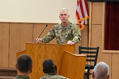 Chaplain (MG) Tom Solhjem speaking at podium