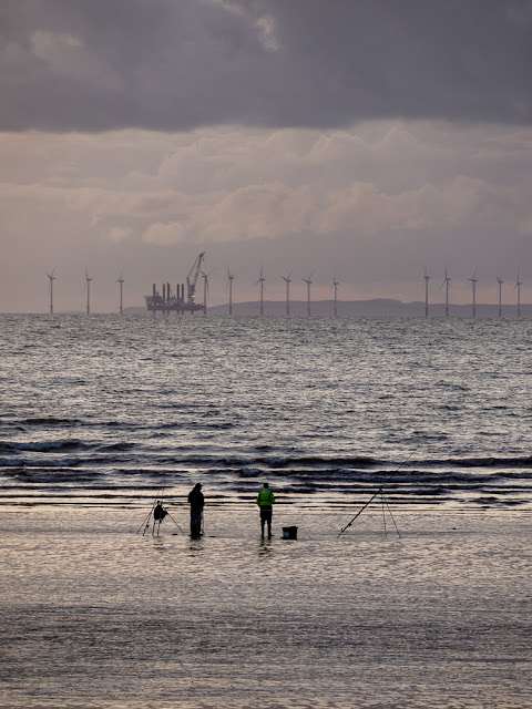 Photo of fishermen on the shore at Maryport