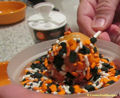 decorate cake pops with holiday sprinkles