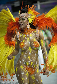 Dazzle: revellers from the Academicos do Tatuape samba school and the samba school Mancha Verde Special Group join in the first night of carnival parade at Sao Paolo's Sambadrome.