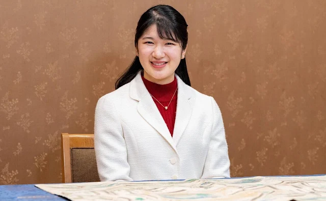 Princess Aiko wore a white tweed jacket, and red midi dress. Emperor Naruhito and Empress Masako