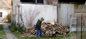 Moving firewood.  Indre et Loire, France. Photographed by Susan Walter. Tour the Loire Valley with a classic car and a private guide.
