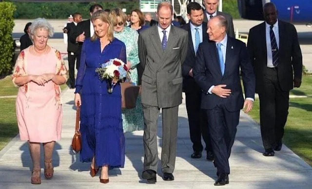 The Countess of Wessex wore a new Sheer crinkle silk-blend blue maxi dress by Me+Em. Isabel Marant Oskan Moon bag
