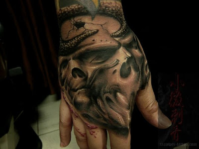 hand free tattoo design and skull tattoo designs