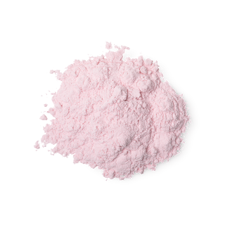 A puddle of crumbly pink tinted talc on a bright background