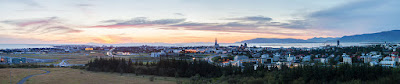 Panoramic photo of Reykjavík seen from Perlan in summer during sunset. As seen in the picture Reykjavík is mild enough to permit the growing of trees.