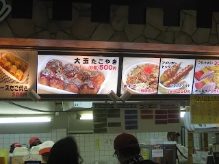 Fast food restaurant with large menu above the counter