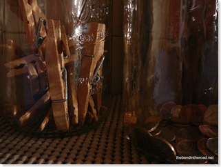 glass jars from the storeroom holding clothespins and pocket money