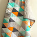 orange and aqua isosceles triangle quilt.