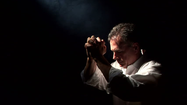 man kneels after communion, holy mass, holy communion,