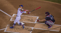 Cubs baseball player Javier Baez batting from home plate at Wrigley Field