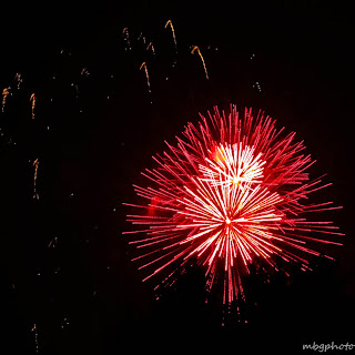 red and while fireworks photo by mbgphoto