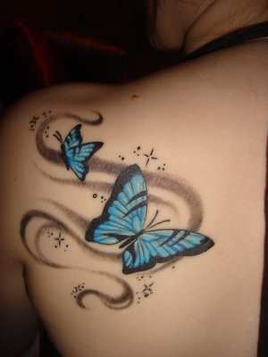 butterfly tattoo on upper back