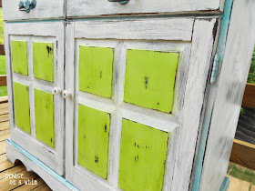 A wet rag worked great for distressing these cupboard doors by Denise On a Whim