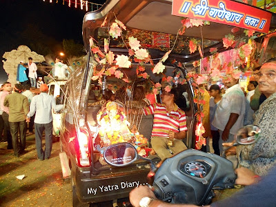 A Ganesha idol being taken for Ganesh Visarjan in car, Mumbai