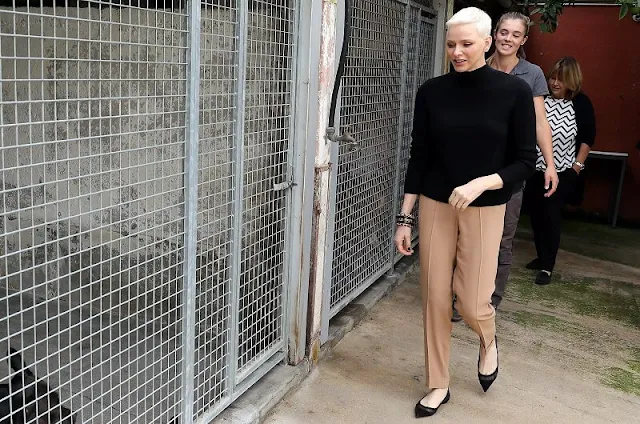 Princess Charlene wore a black turtleneck sweater and beige trousers by Akris. This shelter, is located in the town of Peille