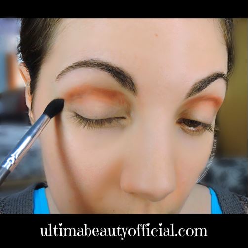 Ultima Beauty applying Espresso Yourself to the crease of the eye