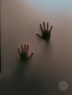Hands shadow on glass 