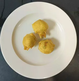 Batata vada, a Indian breakfast items in a plate