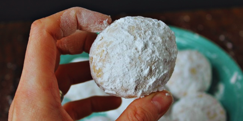 Delicious homemade Snowball Cookies made by Tiff, featuring a dusting of powdered sugar, embodying the festive spirit of Christmas baking. | on the creek blog // www.onthecreekblog.com
