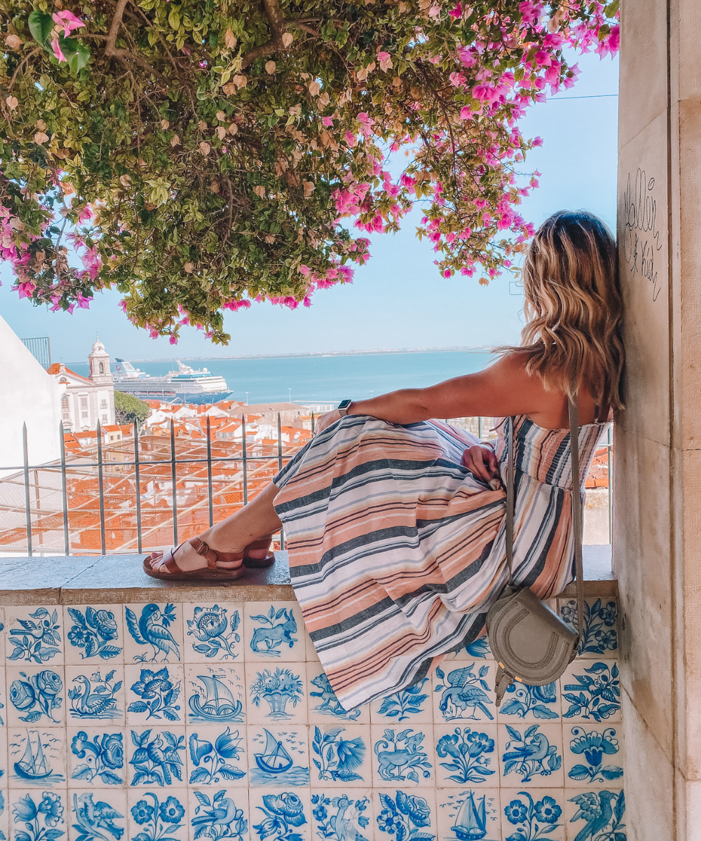Amanda Martin of @amandasok soaks in the view from a Miradouro in Lisbon