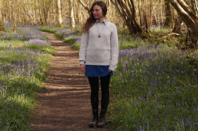 country girl in bluebell wood