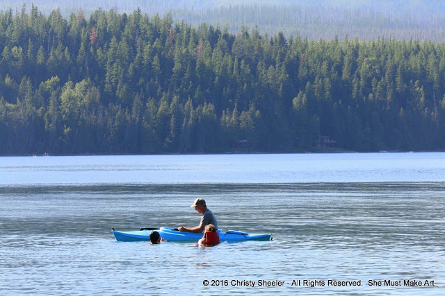 My husband and two children spending time together in the lake.