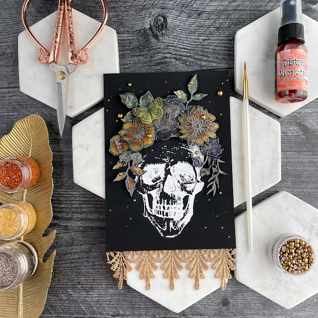 Day of the Dead mixed media watercolor panel created with: Ranger Ink Alchohol Ink matte black cardstock, super fine embossing powder; Tim Holtz halloween distress mica aprays, floral outlines and rest in peace stamps, ephemera; Pinkfresh matte pearls; Reneabouquets lace