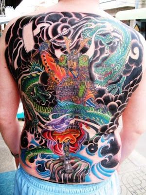 Giant Samurai back piece tattoo with sword.