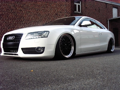 white audi a5 with with black rims and lowering springs