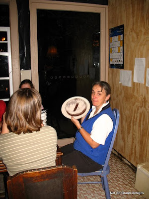  Llick holding up the anniversary cake