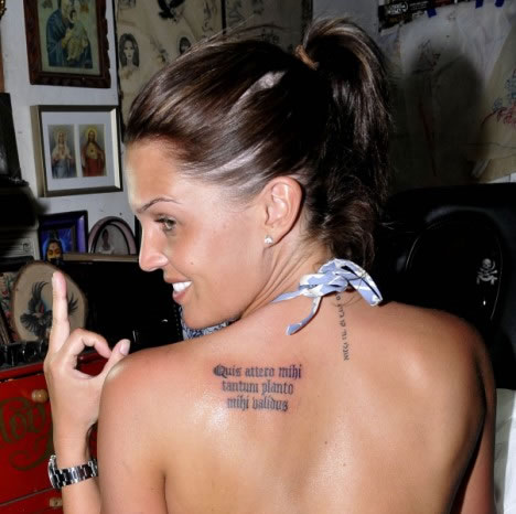 Ms Lloyd also has a Latin phrase on her back left shoulder which reads 