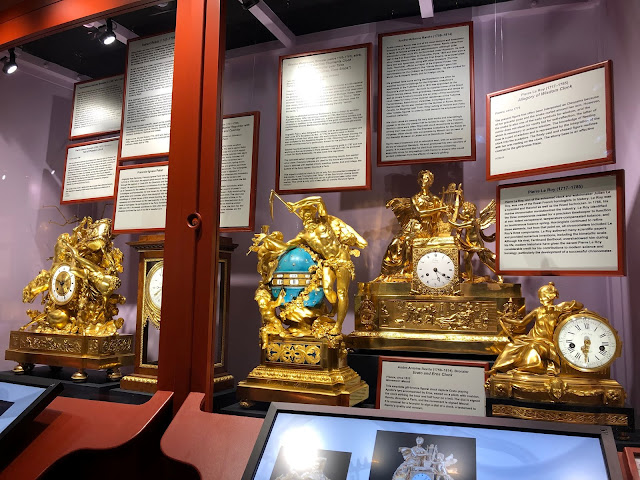 Ornate French clocks. The clock in the center is called The Triumph of Love Over Time. Halim Museum of Time and Glass