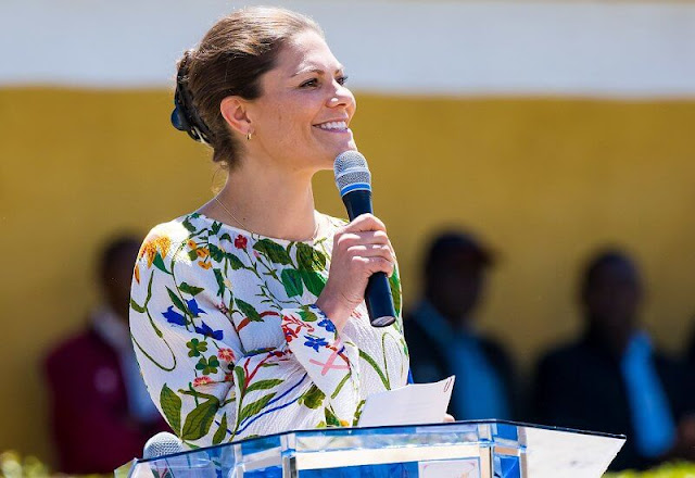 Crown Princess Victoria wore an Irmaline floral print maxi dress, floral top and skirt by Rodebjer. The Gundua Foundation