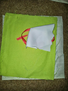 Green backing cloth of the P letter with some white and pink - photo to use to asses possible colour combinations