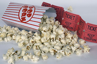 Movie theater popcorn with theater tickets