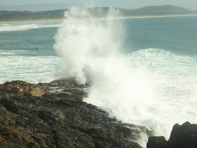 wave breaking with tremendous power at moonee beach, coffs harbour, nsw, australia