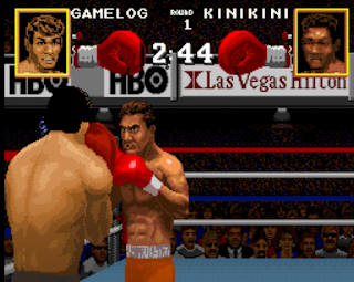 Two 16 Bit men boxing one called GAMELOG and another called Kinikini European themed men here in light blue boxing ring with red,white and blue ring coloures around the edges