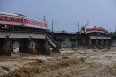train: Other bridge collapses: a metaphor of not taking care of Mother Earth beforehand. And after the damage, a metaphor of stopped lives for people and communities: