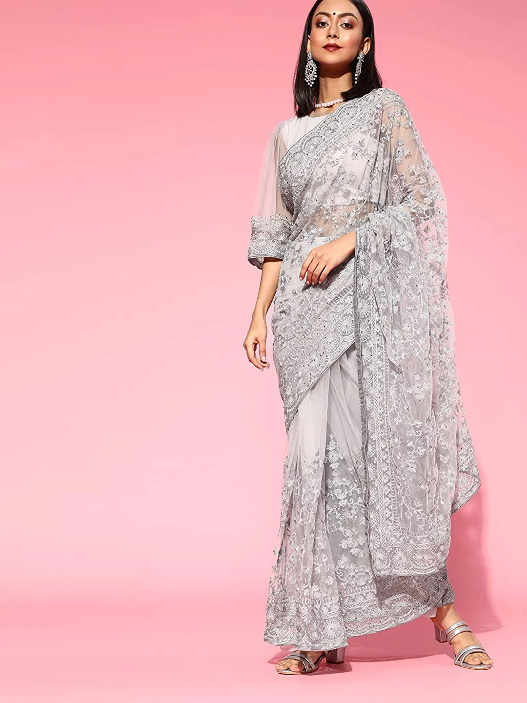 Womanista Women’s Light grey net saree with heavy embroidery and Swarovski crystals