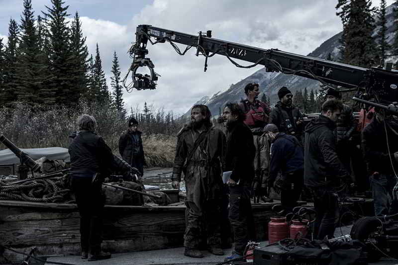 Cast, crew and crane in The Revenant set