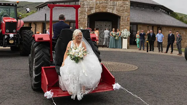 British bride arrived for her wedding in a tractor
