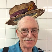 rider wears hat at 23rd Street subway station in NYC