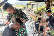 Ajarkan Kebersihan dan Kerapihan Sejak Dini, Prajurit Cakra Jawara Gelar Potong Rambut Gratis di Papua Pegunungan